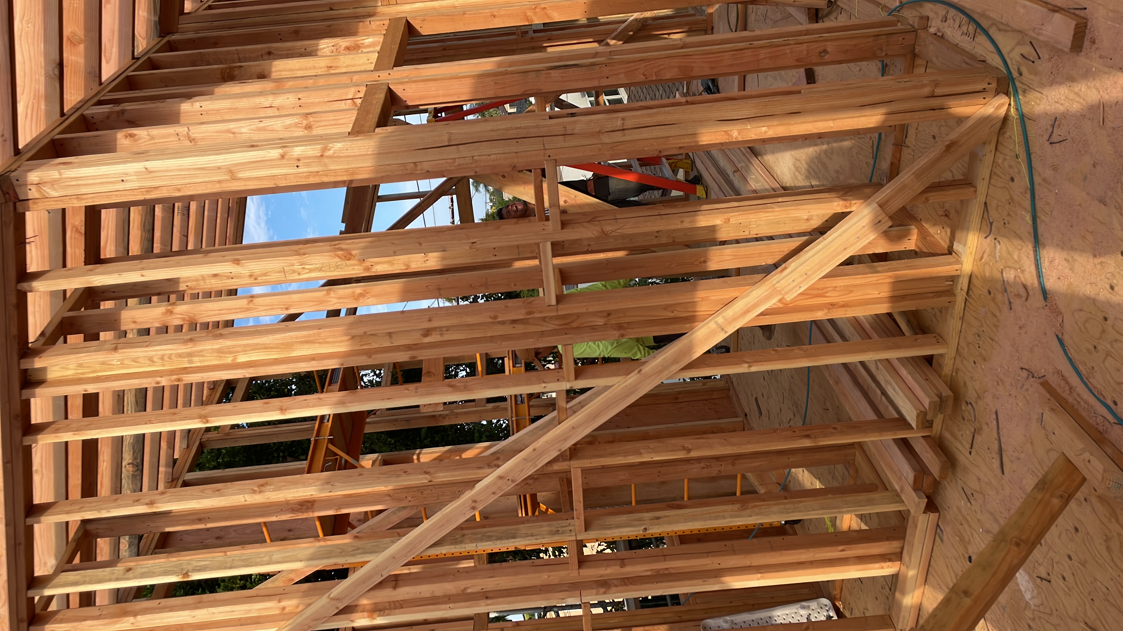 Structural roof framing underway on an Arrow Construction project in El Cajon
